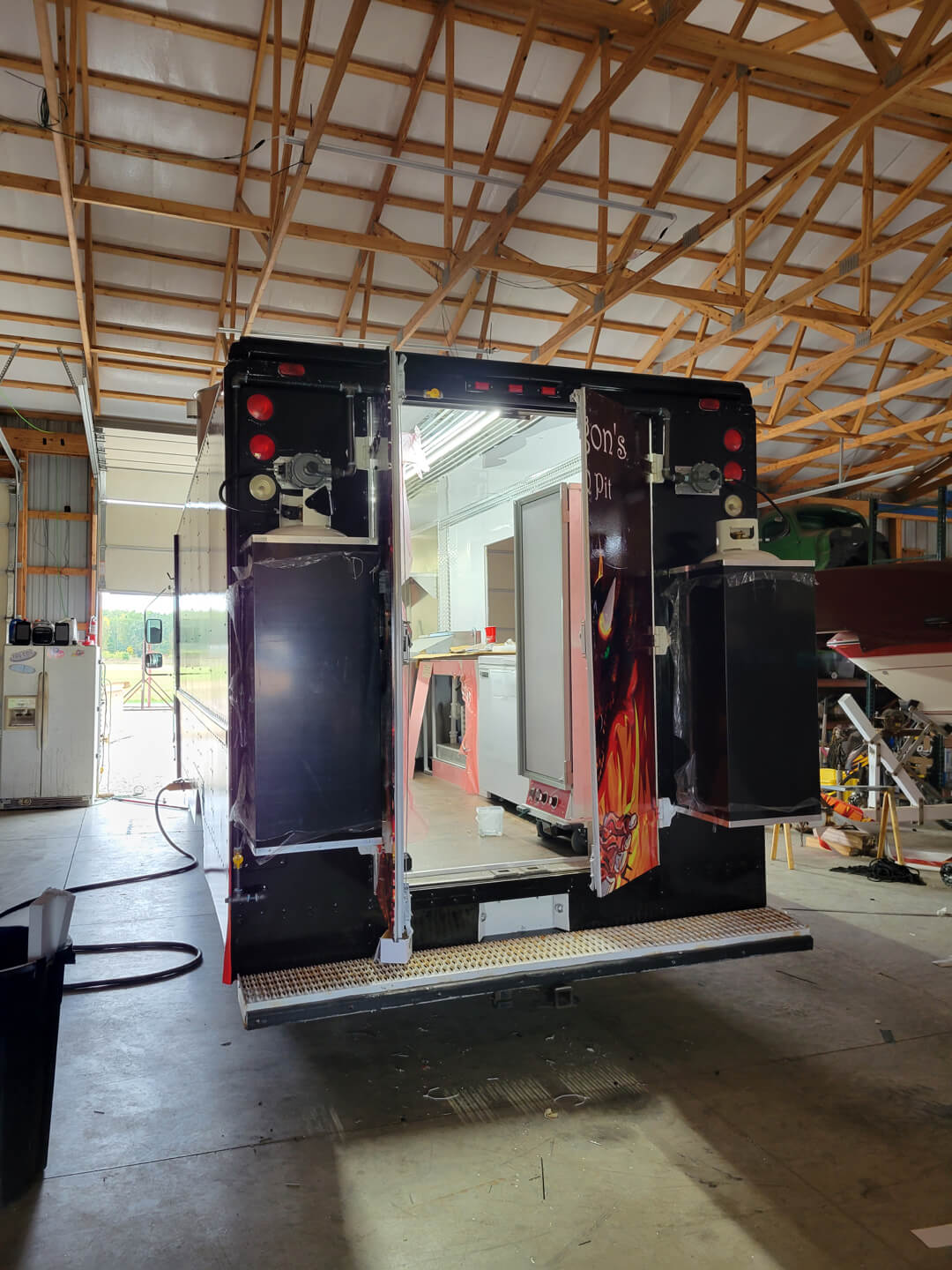 Back door of food truck with gas tanks