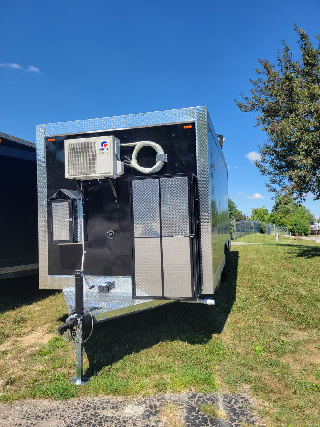 Fan and exterior of black trailer